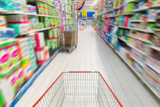 shopping cart in supermarket blurred Supermarket interior