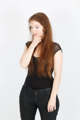 Fototapeta premium Beautiful businesswoman doing different expressions in different sets of clothes: thinking