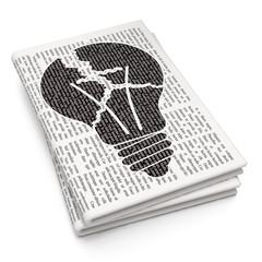 Business concept: Light Bulb on Newspaper background