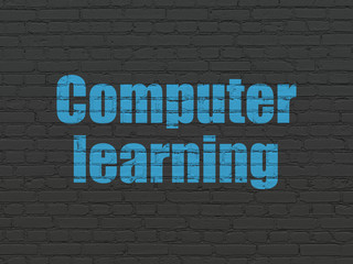 Learning concept: Computer Learning on wall background