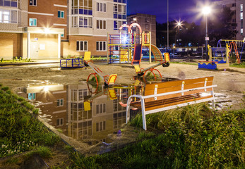 children's playground in the courtyard at night