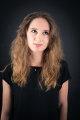 Fototapeta premium Beautiful woman doing different expressions in different sets of clothes: thinking