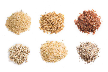 Collection of dry cereals on white background