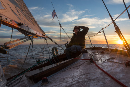 Senior retired sailing Buenos Aires River to Uruguay. Sport free