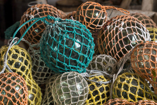 A collection of glass balls in colored net
