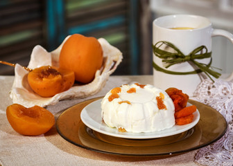 Russian kitchen. Country cheese pudding with peaches and dried apricots. Tea with lemon. Vintage utensils.