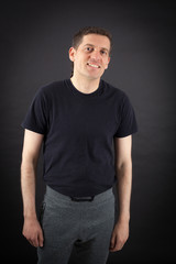 Handsome man doing different expressions in different sets of clothes: smile