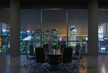 Panoramic conference room in modern office, cityscape of Singapore skyscrapers at night. Black...