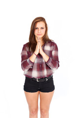 Beautiful woman doing different expressions in different sets of clothes: praying