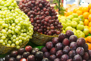 Fruit Stall with Grapes and Plums