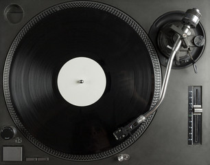 Obraz premium Turntable playing vinyl close up with needle on the record