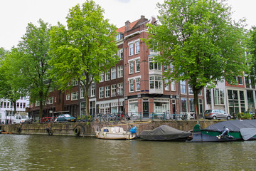 Fototapeta na wymiar Boats on a canal in Amsterdam. Netherlands