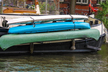 Fototapeta na wymiar Canoes on board the ship in Amsterdam