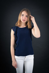 Fototapeta premium Beautiful woman doing different expressions in different sets of clothes: you are crazy