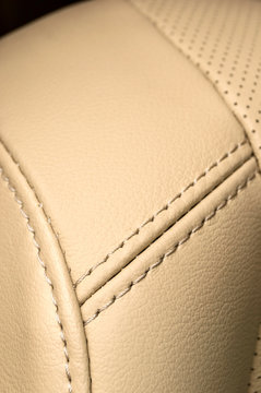 Business car interior detail. Leather background.