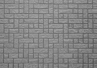 Black brick stone wall seamless background and texture