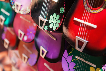 Background of colorful mexican guitars