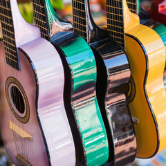 Background of colorful mexican guitars