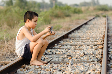 lonely boy sit in the old room