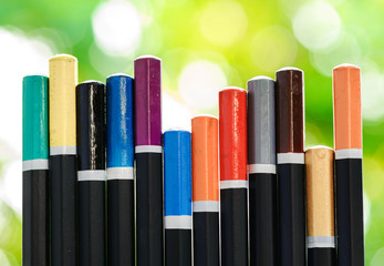 Obraz premium Bottom of color pencil on green bokeh