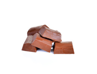 chocolate pieces on white background