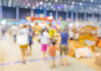 blurred image of shopping mall and people