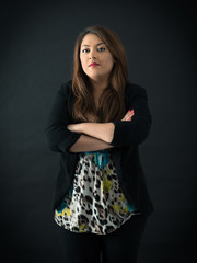 Beautiful woman doing different expressions in different sets of clothes: arms crossed