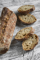 rye baguette on a light wooden background