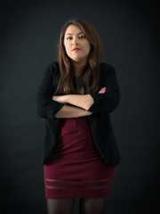 Beautiful woman doing different expressions in different sets of clothes: arms crossed