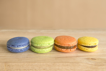 Macarons on wooden and glass-colorful.