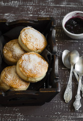 English scones for Breakfast in a vintage tray on brown wooden background