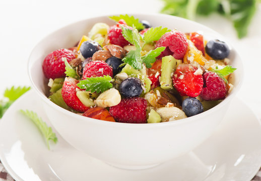 Salad with fruits and berries. Healthy breakfast.