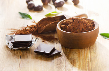 Chocolate bars and a bowl of cacao powder.