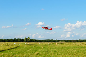 Small sport plane in air