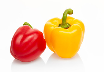 Yellow and red peppers isolated on white background. Clipping path included
