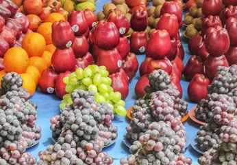 Odd amongst Evens -Market place selling fruits -arraneged,patter