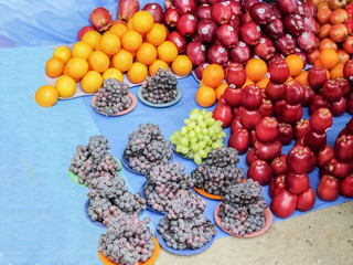Market place selling of fruits arraneged in pattern
