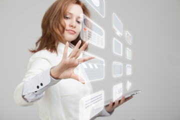 Woman pressing high tech type of modern multimedia buttons on a