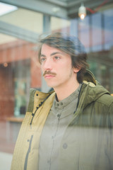 Fototapeta premium Young handsome caucasian man with moustache