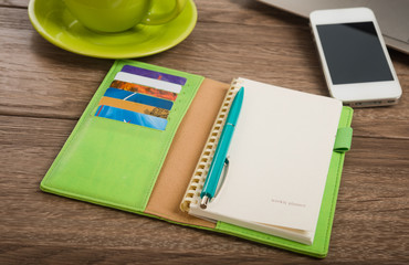 Office desk with laptop computer, tablet pc, planner, pen, mobil