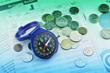 Blue compass on graph paper, saving concept