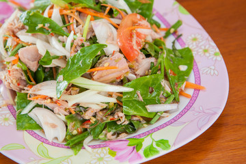 close up Tuna with tea leaves and mix vegetables , spicy salad