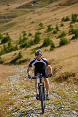 Fototapeta premium Mountain biker on trails