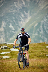 Fototapeta premium Mountain biker on trails