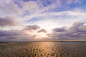Fototapeta premium Sunset, sunbeam, sky, sea, coast. Okinawa, Japan, Asia.