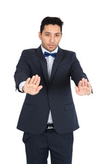 Handsome man doing different expressions in different sets of clothes: stop sign