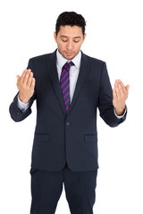 Handsome man doing different expressions in different sets of clothes: prayer