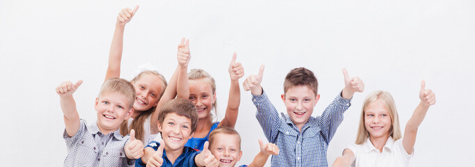 Portrait of happy children showing thumbs up gesture
