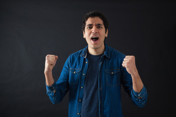 Fototapeta premium Handsome men doing different expressions in different sets of clothes: arms raised