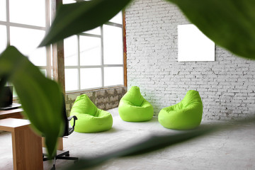  Interesting design on a background of white bricks with green decor